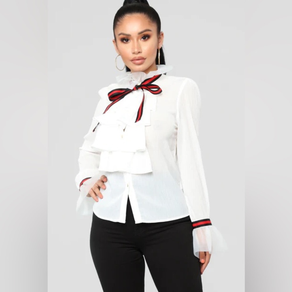 White Ruffled Blouse with Red and Blue Bow